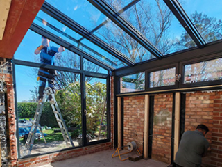 Glass-roofed garage conversion extends the living space