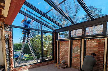 Glass-roofed garage conversion extends the living space