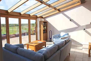 Solarlux Bifold Doors and Glass Roof – Solid Oak & Aluminium