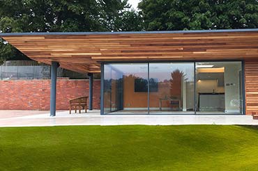 Cero slim profile sliding doors with open corner in a garden room