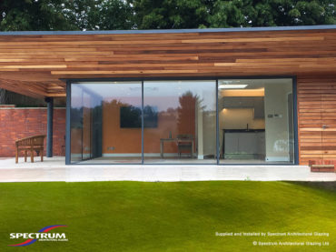 A Garden room in Buckinghamshire with Cero slim-profile sliding doors and an open corner. Installed by Spectrum