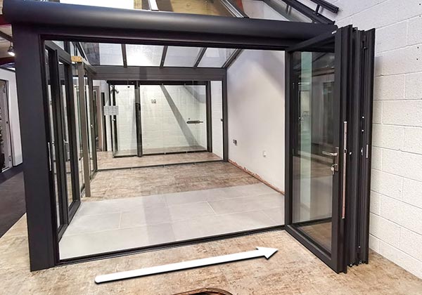 Bifold doors stacked at one end