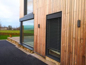 Internorm HF310 timber-aluminium windows with blinds - exterior - grey aluminium