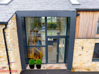 Internorm HF310 timber-aluminium fixed windows and entrance door - exterior - grey aluminium Internorm HF310 timber-aluminium fixed windows and entrance door - exterior - grey aluminium