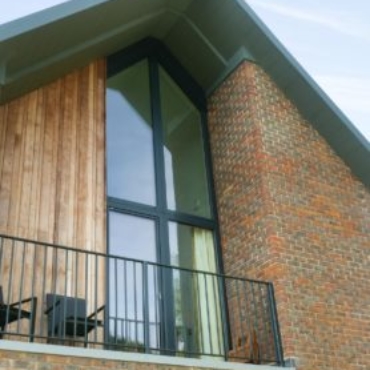 Internorm HF310 timber/alu window into eave in custom built home