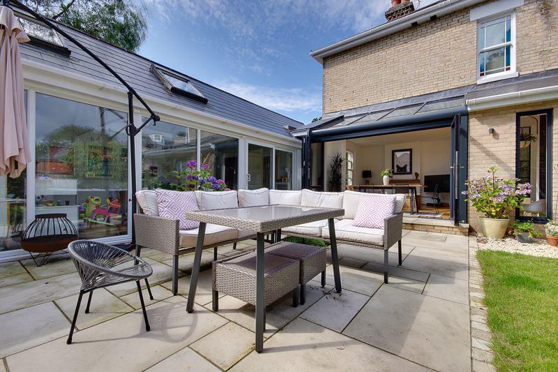 Solarlux Avantgarde Oak/Aluminium Glass Roof and bifold doors - garden view