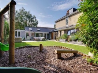2019-0964-17 Solarlux Avantgarde Oak/Aluminium Glass Roof and bifold doors - garden view