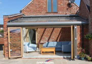 Solalrux oak/aluminium glass roof + oak bifolding doors