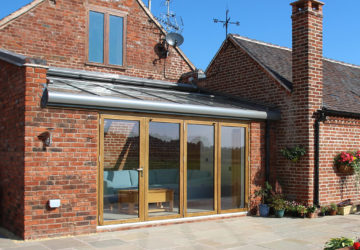 S olalrux oak/aluminium glass roof + oak bifolding doors