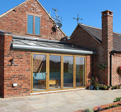 Solarlux oak/aluminium roof with Solarlux oak bifolding doors