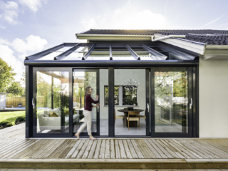Soalrlux Wintergarden with lady opening the sliding doors