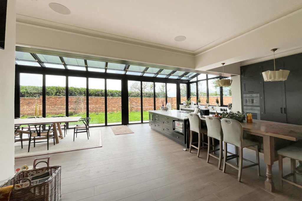 Solarlux glass extension from the open-plan kitchen dining area