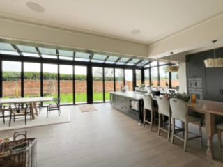 Solarlux glass extension from the open-plan kitchen dining area
