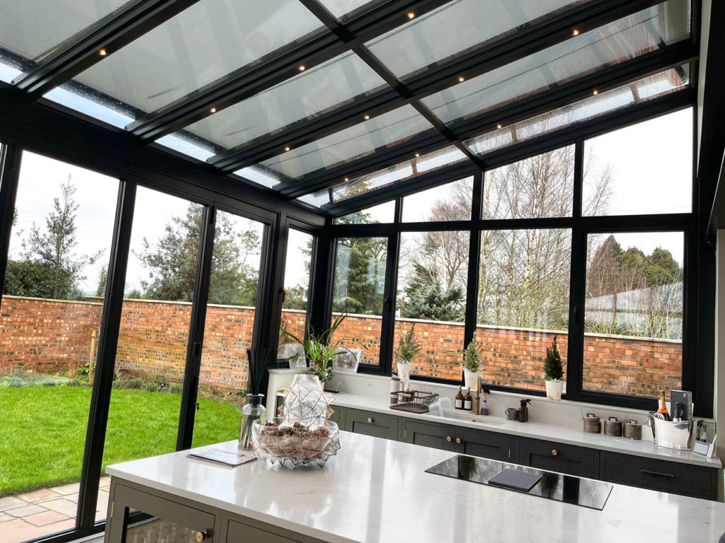 2023-0362-06 View of the external awning over the glass extension providing shade when needed.