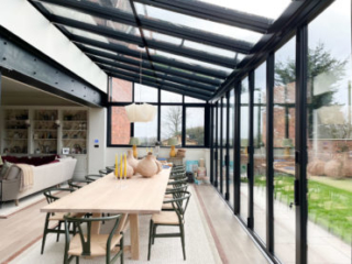 A closer view of this big Solarlux glass extension towards the dining table and dining area