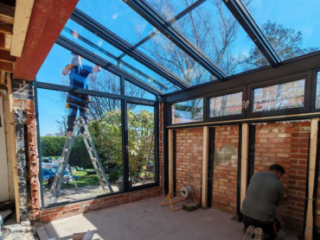 A garage converted to a glass-roofed extension to the living room