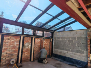 20230380-02 A garage converted to a glass-roofed extension to the living room (rear view)