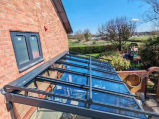 20230380-04 The glass roof of this living room extension with anwning