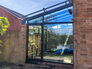 20230380-05 Glass-roofed living room extension - view form garden
