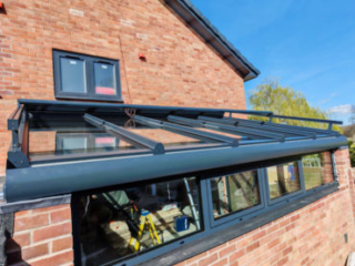 Glass-roofed living room extension - side windows
