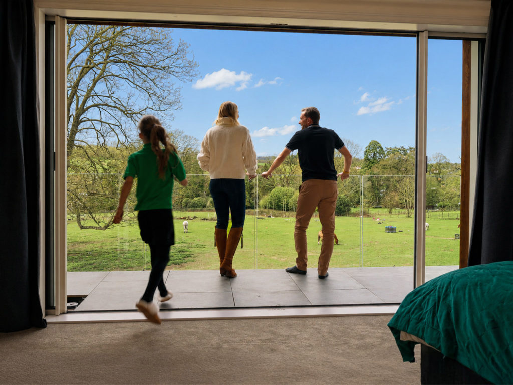 The family enjoying the view from the master bedroom