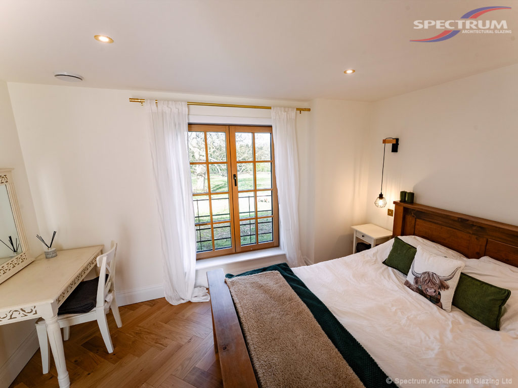 Timber-aluminium window in a bedroom